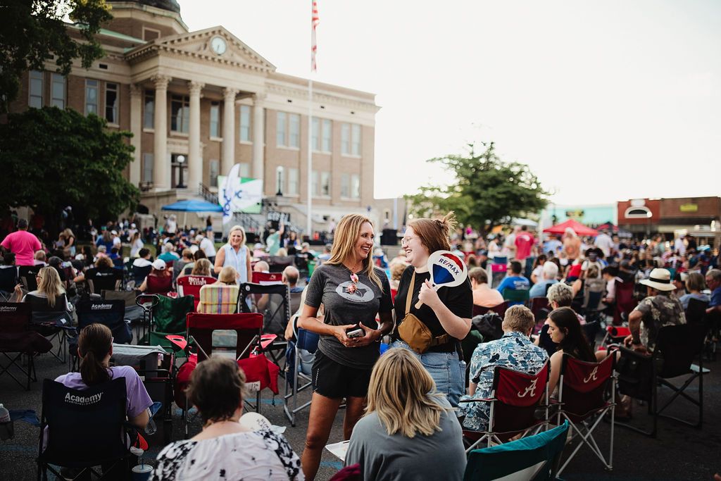 Photo in front of Athens courthouse of a large community gathering on lawnchairs