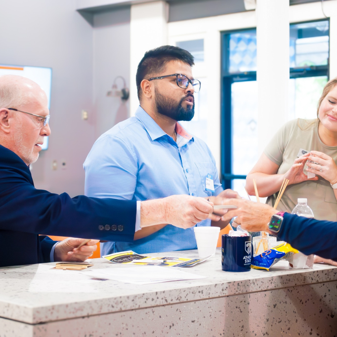 Photo of professionals exchanging business cards